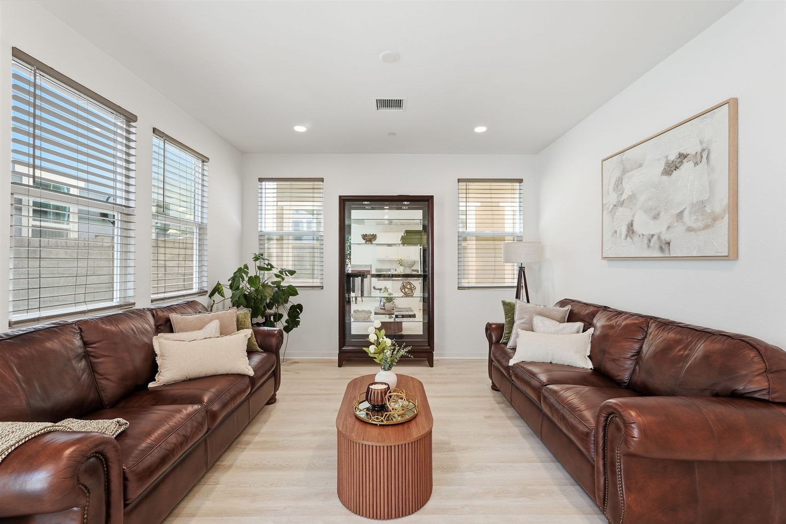 Sandpiper residence living room with warm leather sofas